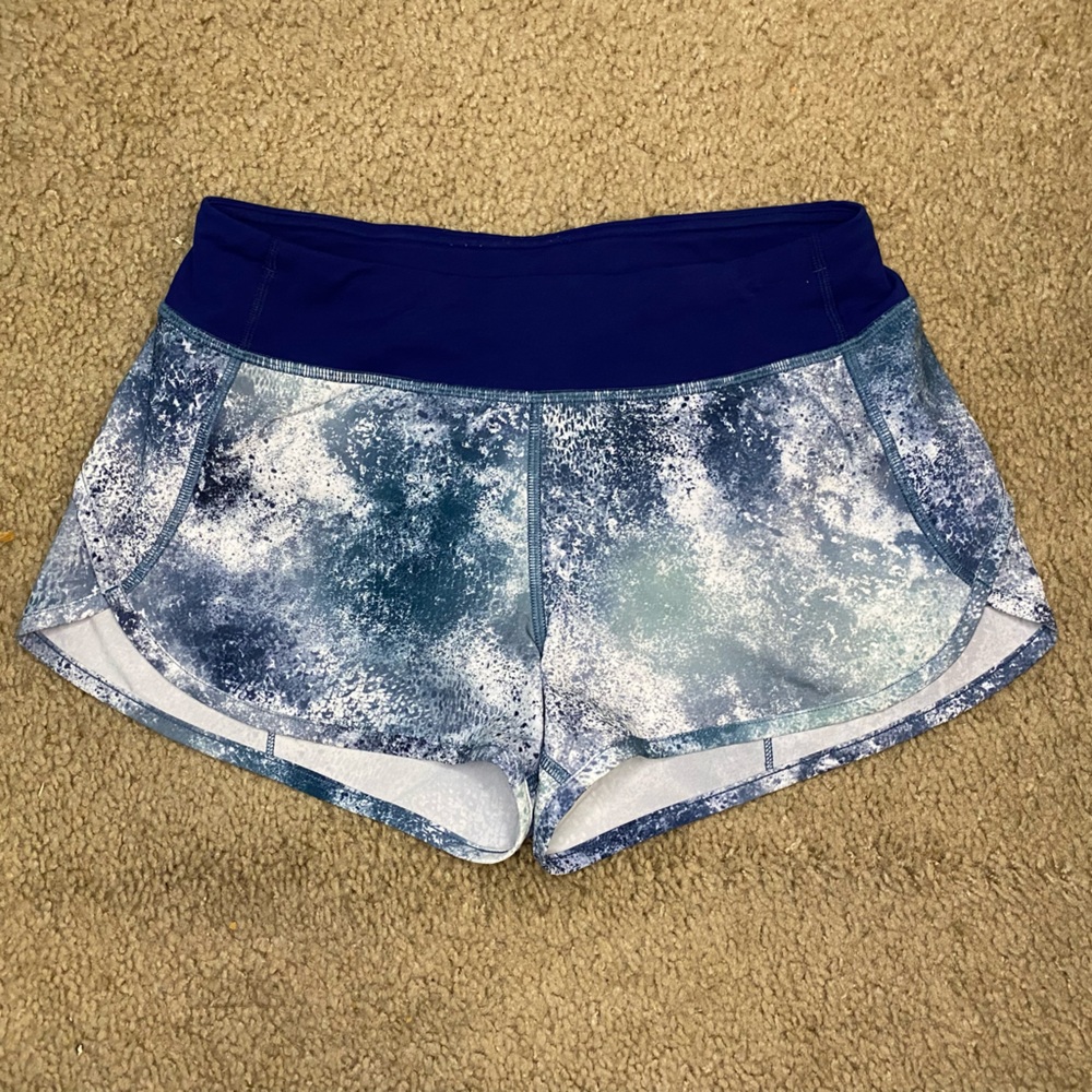 Ivivva by Lululemon Speed running shorts in a blue, white, and black